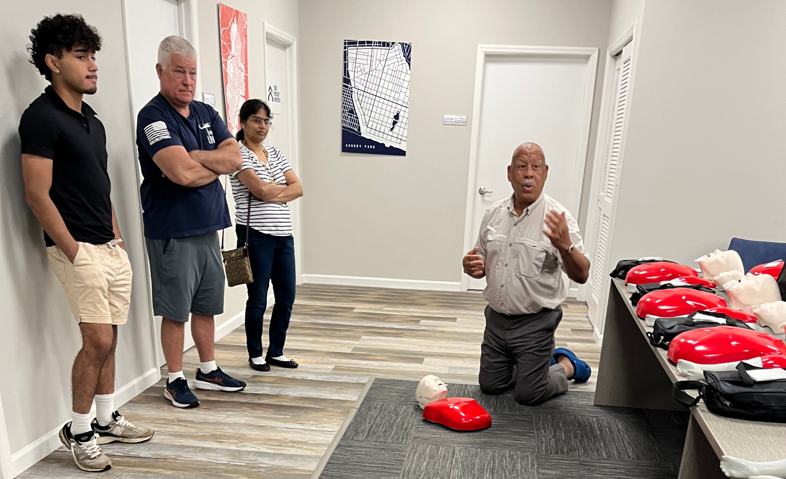 Ronald M. Allen coaching students through hands-on CPR and AED practice
