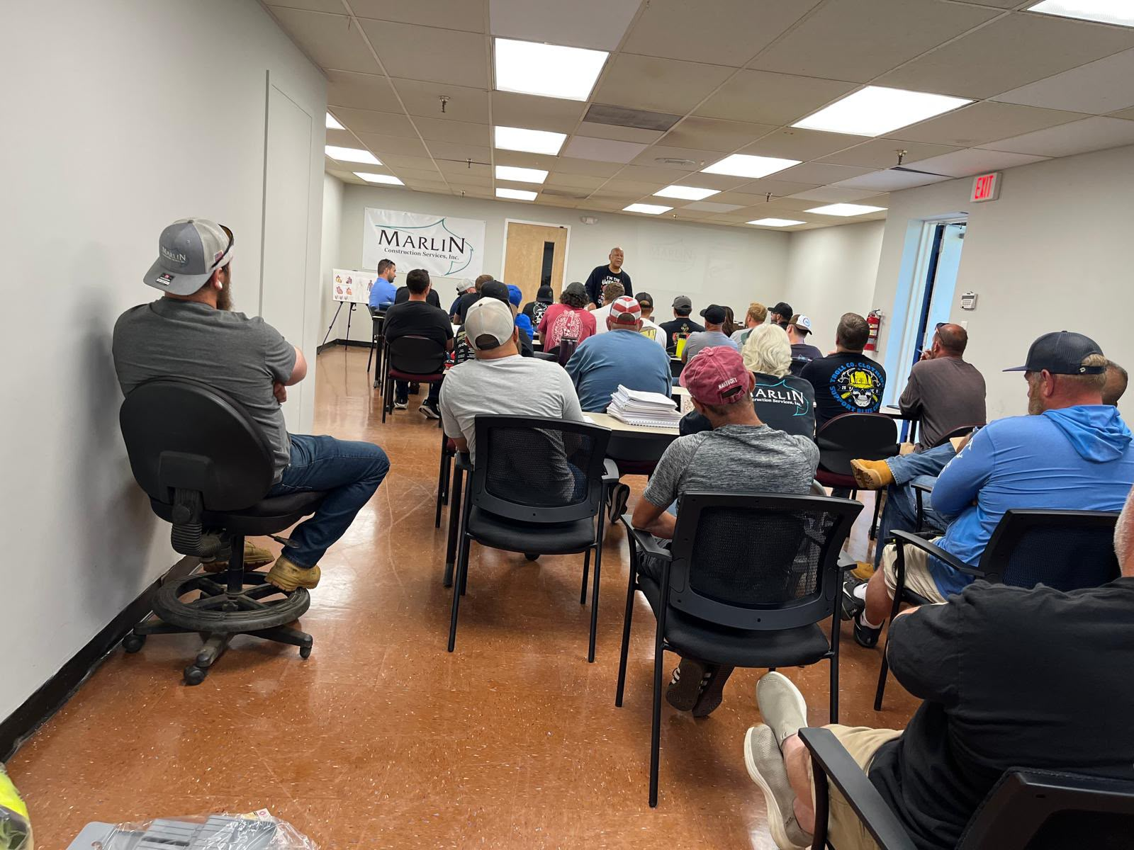 Contractor group receiving hands-on CPR and First Aid training in a classroom